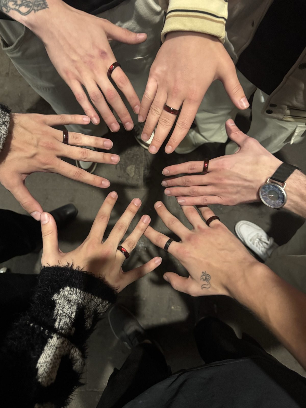 A circle of fans all wearing The Ring by Lux at a show